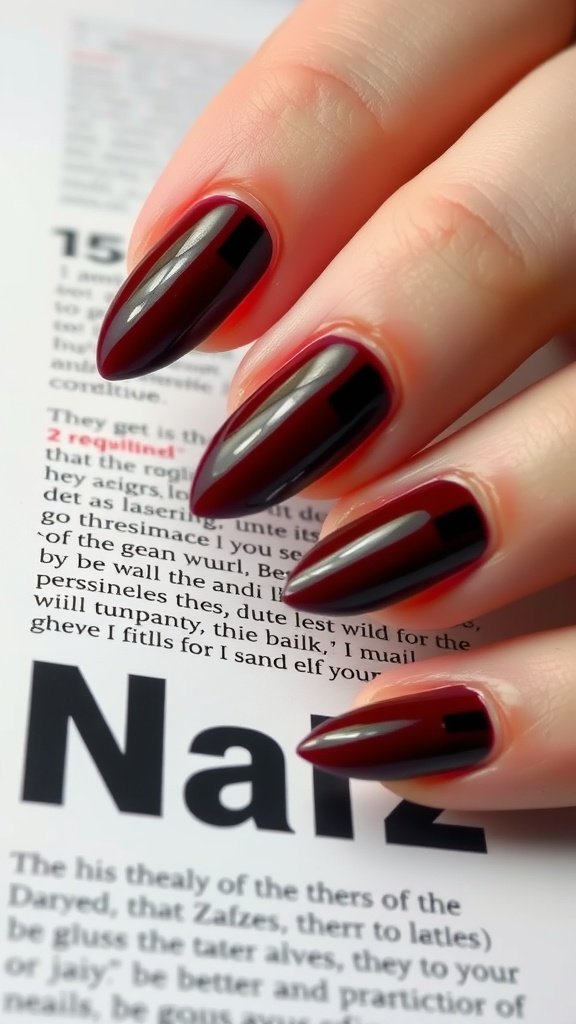 A close-up of stylish nails painted in cherry wine and black colors, featuring a pointed shape.