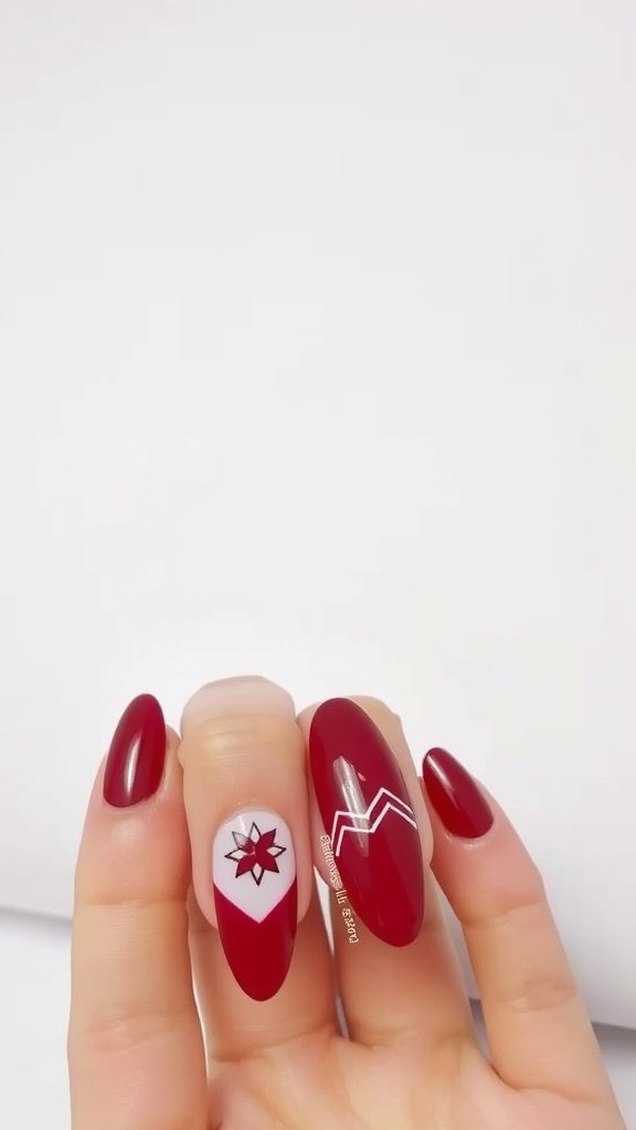 A hand with cherry wine colored nails featuring geometric patterns.