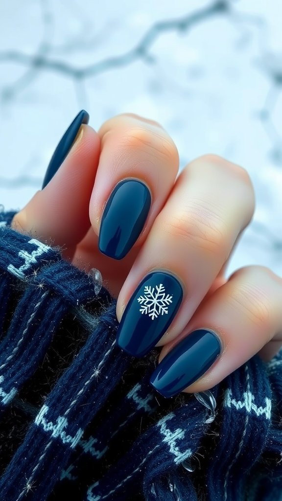 Navy blue nails with ice crystal design on a knitted scarf background.