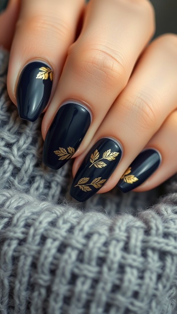 Navy nails with gold leaf designs on a knitted background